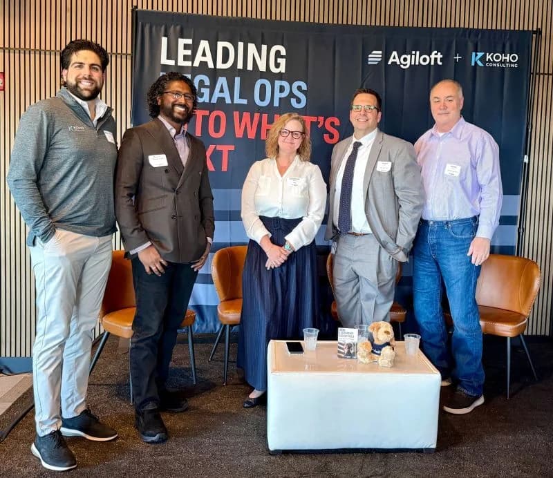 The Koho and Agiloft teams in front of the Leading Legal Ops into What's Next event backdrop.
