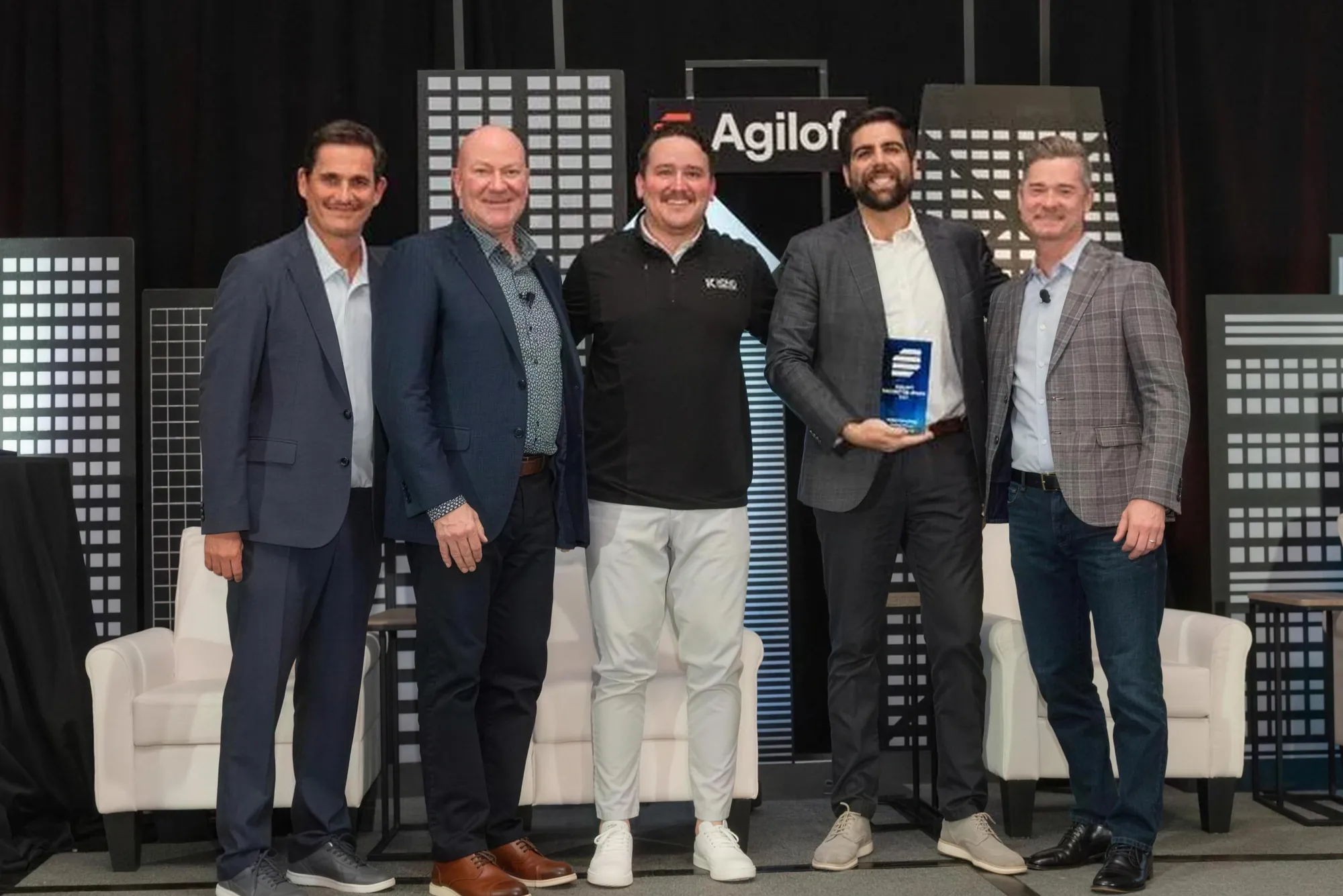 The Koho team on stage accepting an Agiloft Partner of the Year award.