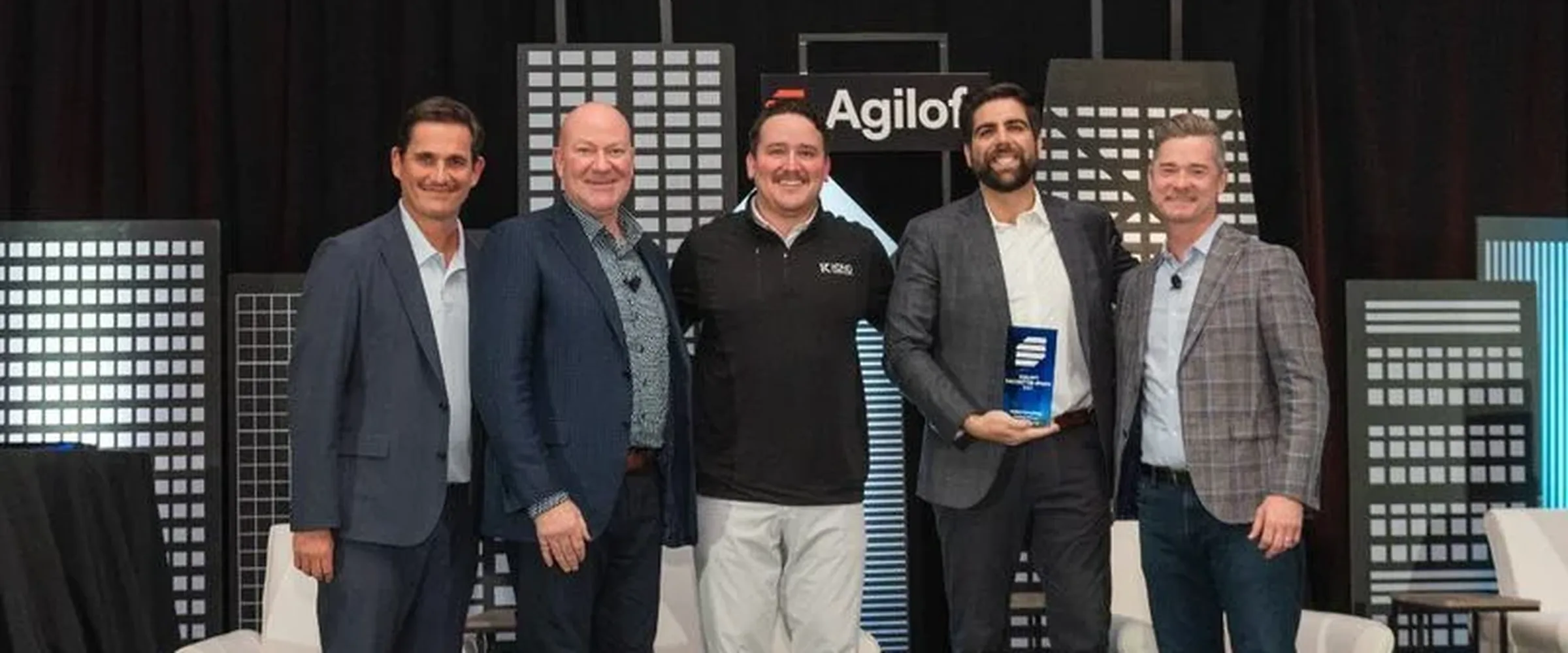 The Koho team on stage accepting an Agiloft Partner of the Year award.