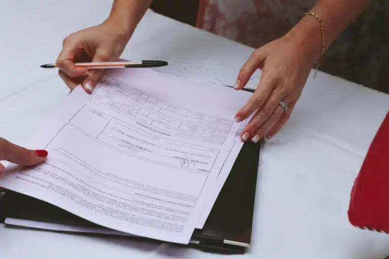 Someone preparing to sign a contract.